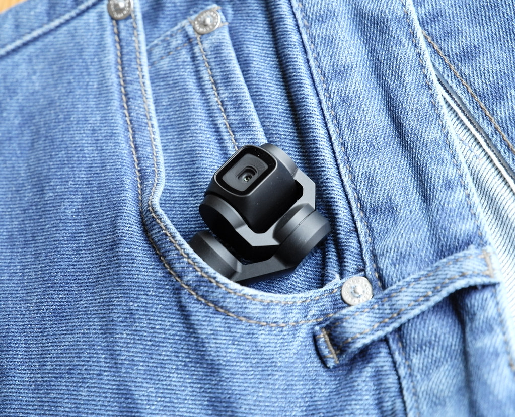a photograph of an video camera in pocket of a par of jeans